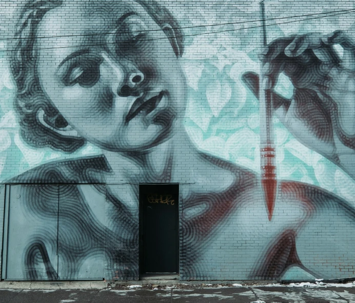 a mural of a woman holding a knife