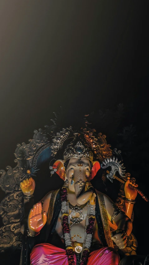 a statue of lord ganesh in the dark