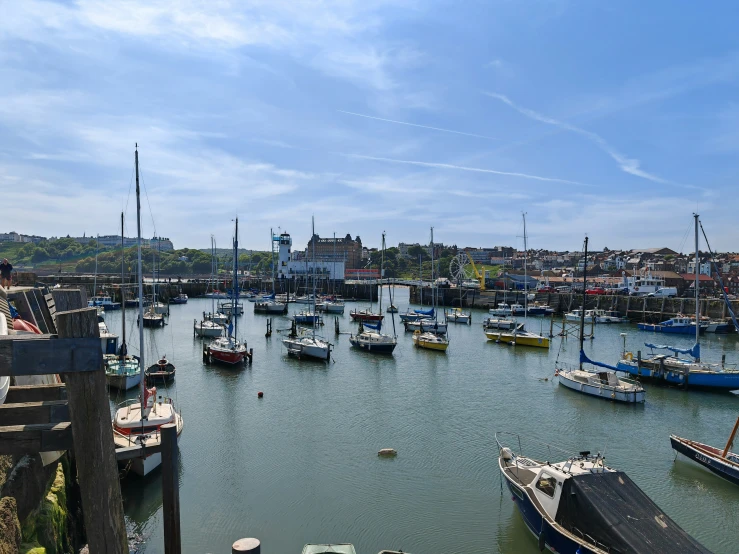 some small boats are parked at the dock