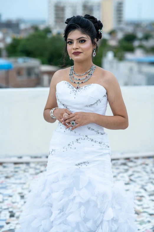 woman in white bridal outfit looking over shoulder