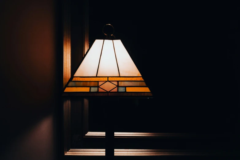 a very pretty looking lamp sitting next to a mirror