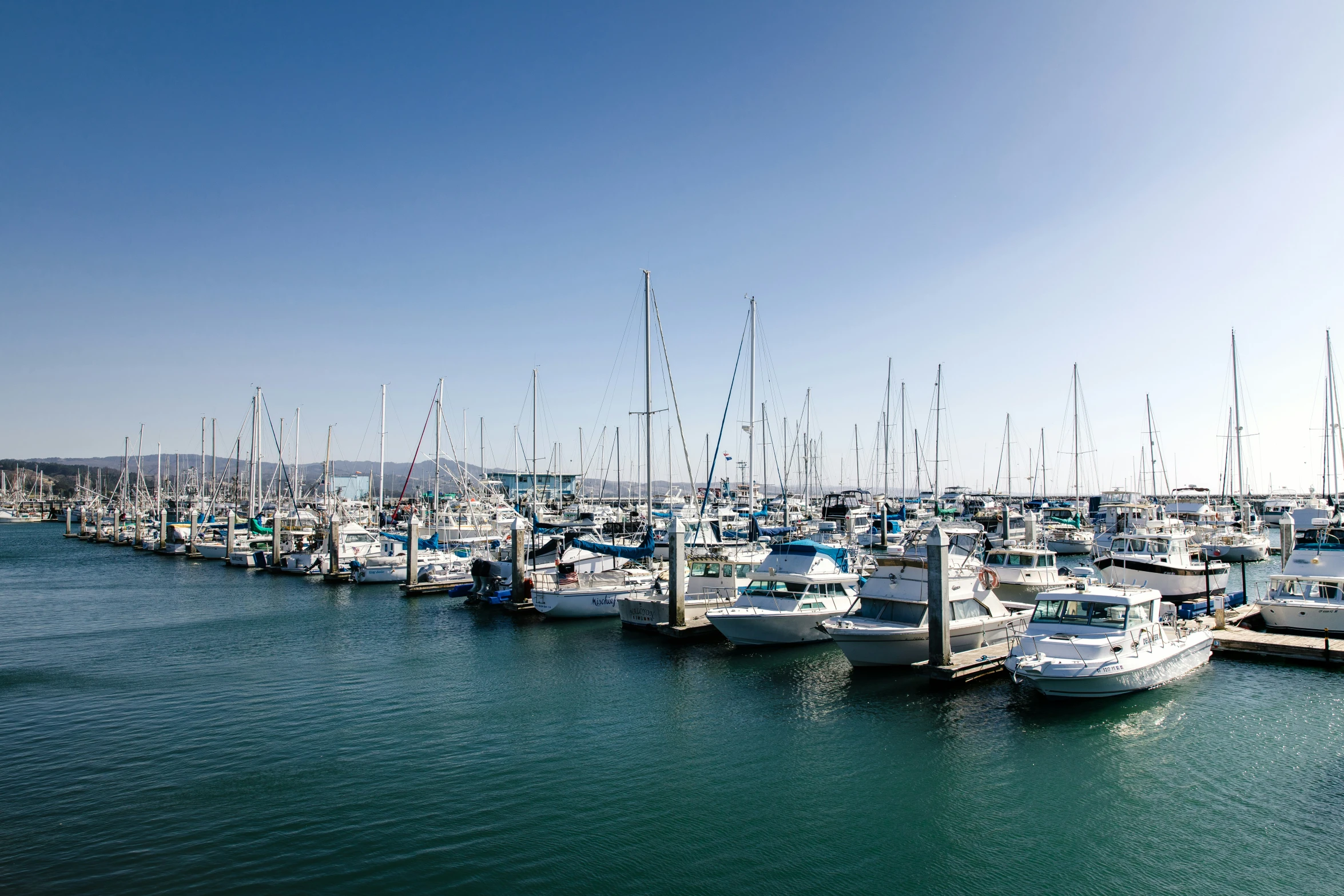 an open sea filled with lots of boats