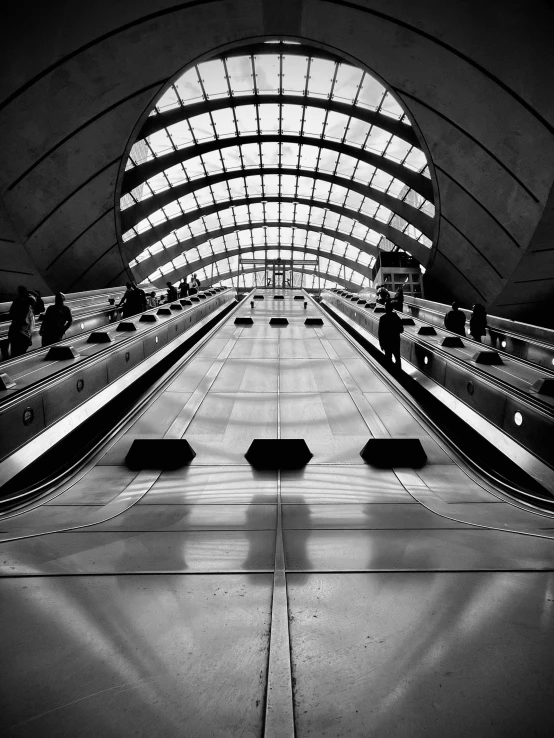 an empty escalator in the middle of a building