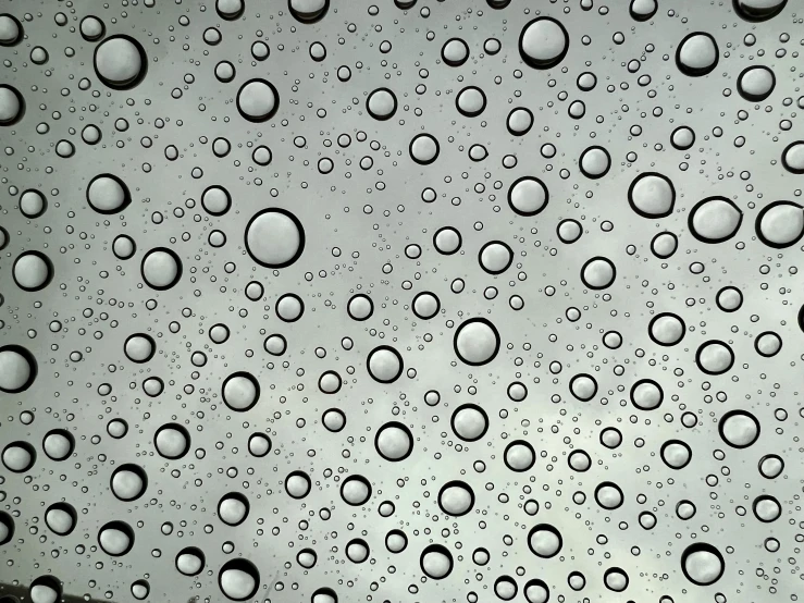 the drops of water on a window that is being used to refreshment people