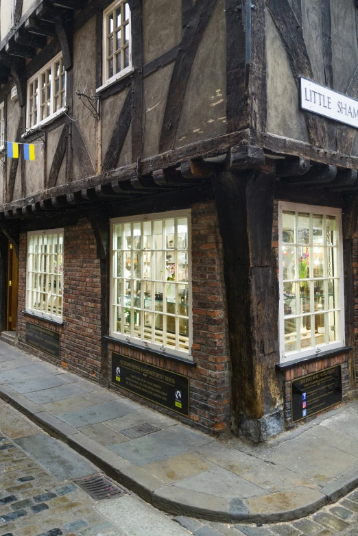 a very old looking brick building with many windows