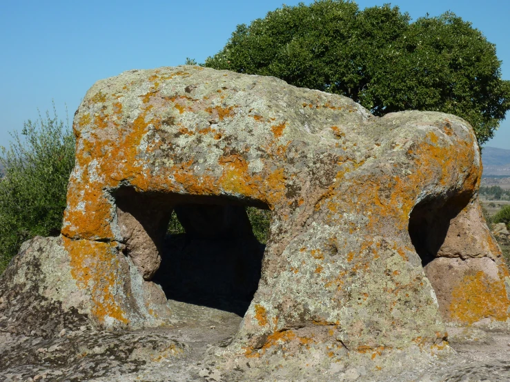 large rock with a doorway at the top of it