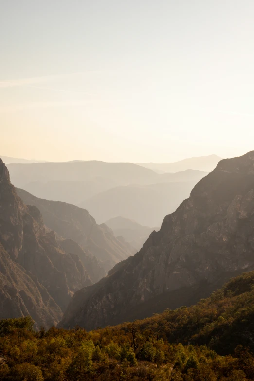 a view of some mountains covered in vegetation