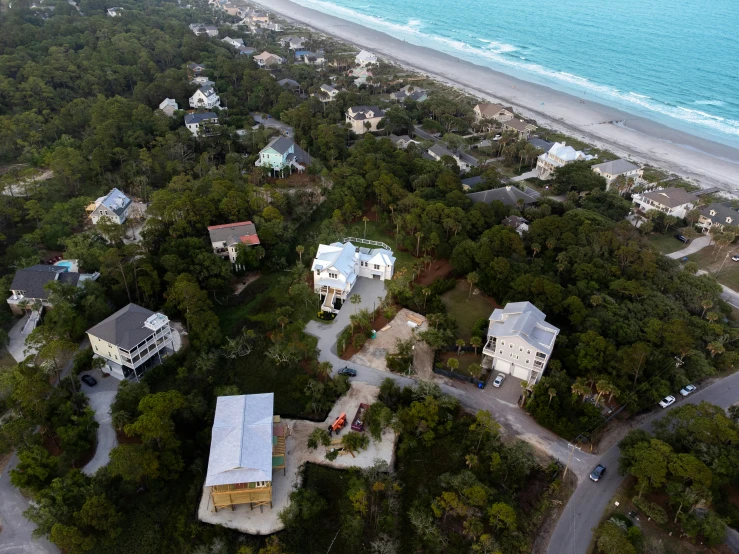 a scenic view from above of houses in the woods