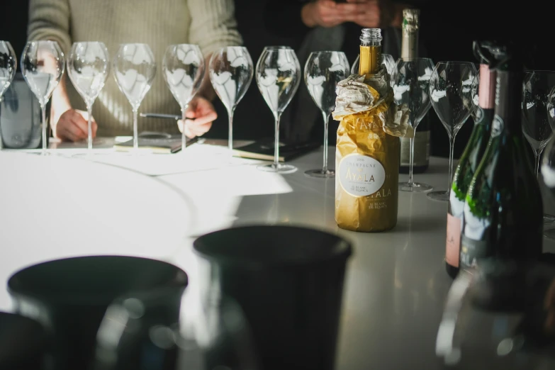 a table topped with lots of wine glasses