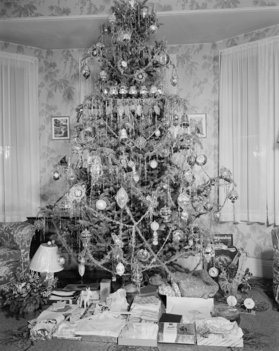 a christmas tree sitting next to an old fashioned couch