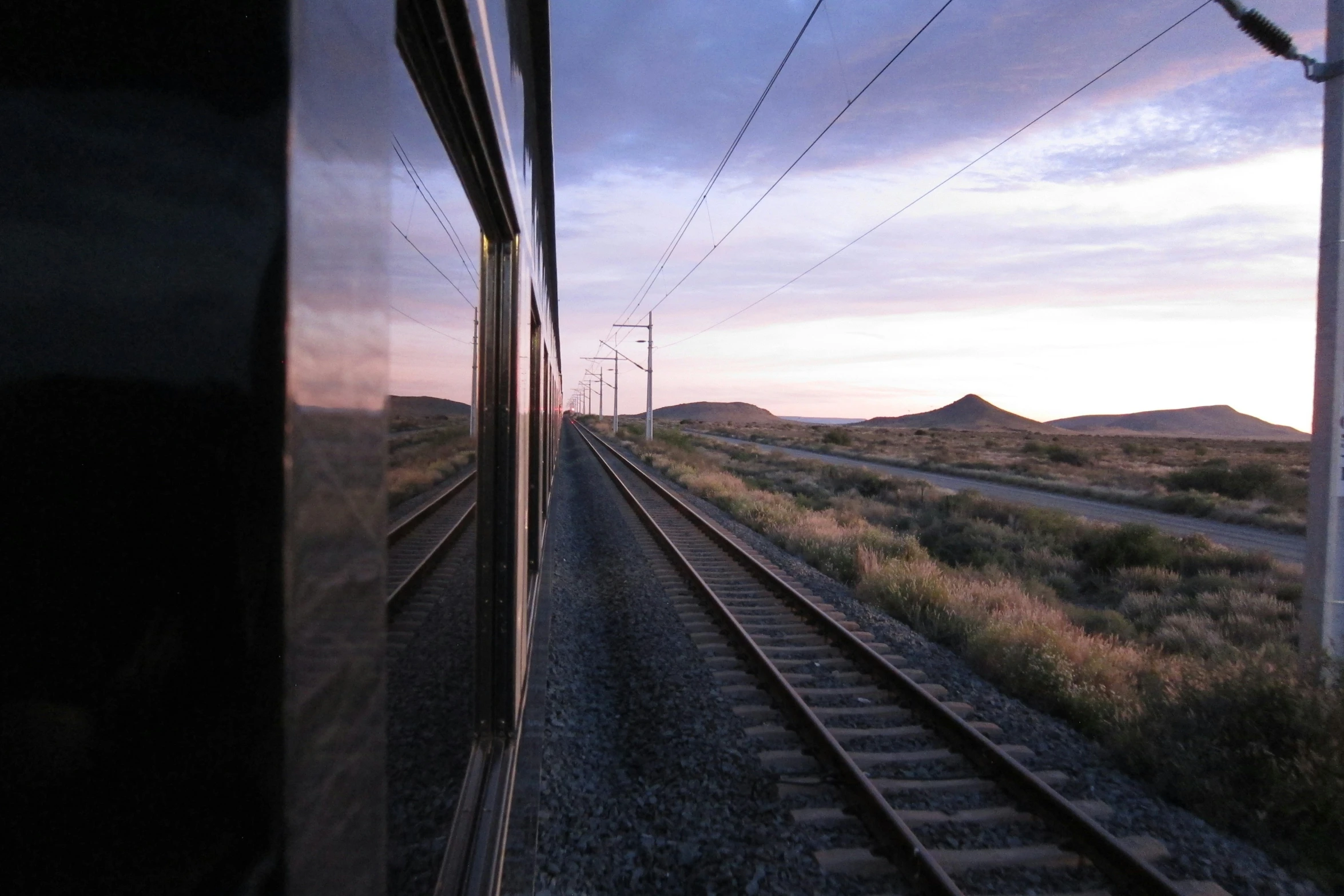 some train tracks leading away from the camera