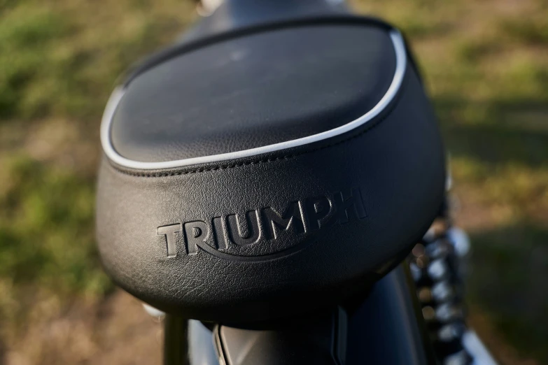 the seat of the motorcycle has a name on it