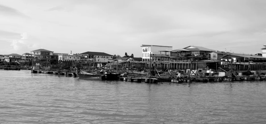 a body of water with several different types of boats