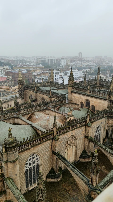 large and old buildings with towers, clocks, and other architectural objects