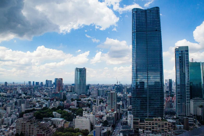 the view of buildings in new york, with clouds