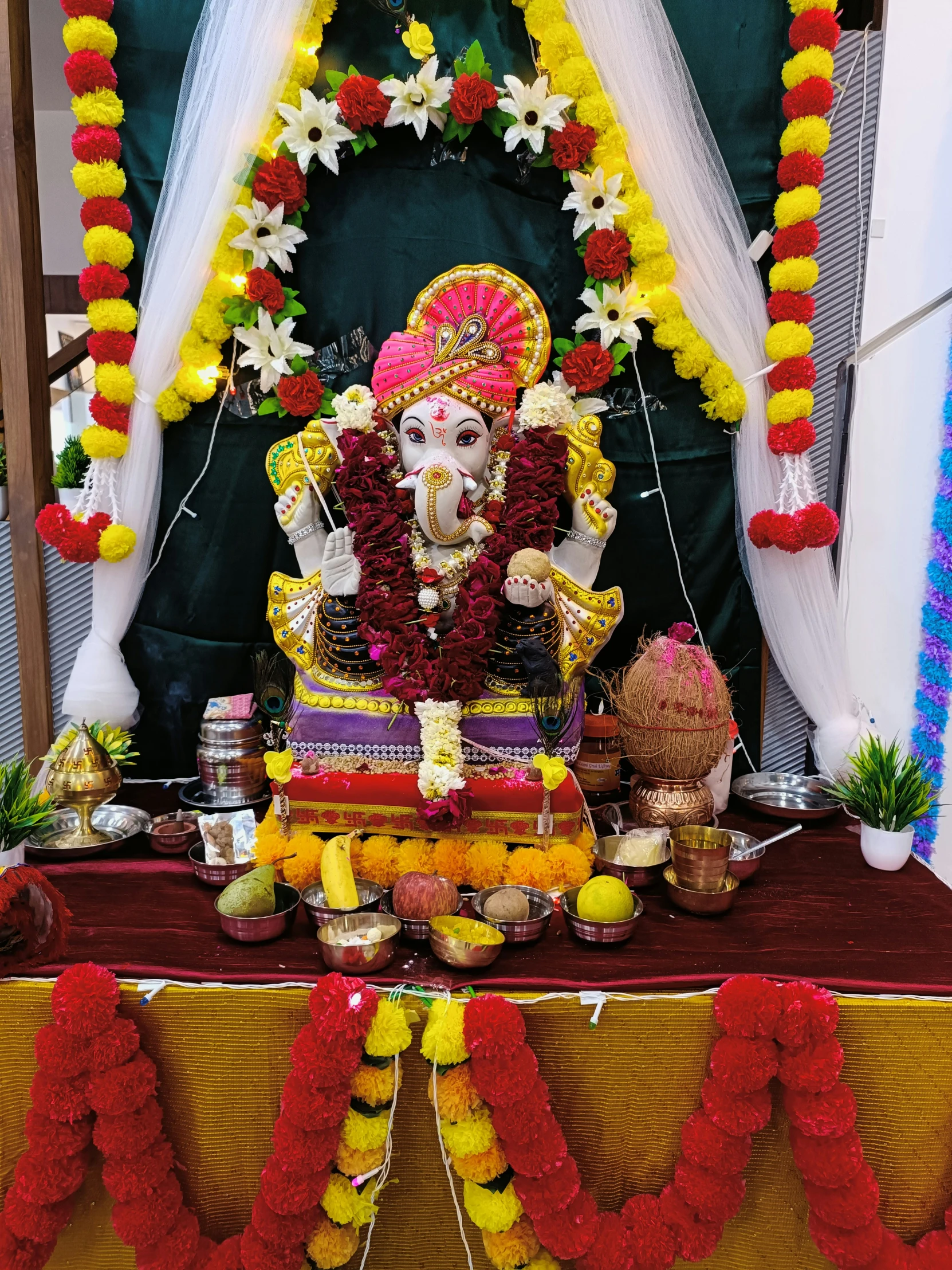 a man in an elaborately decorated statue at a temple