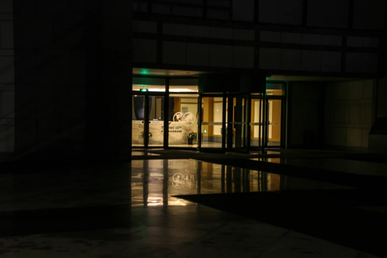 a building that has an entrance to another building at night