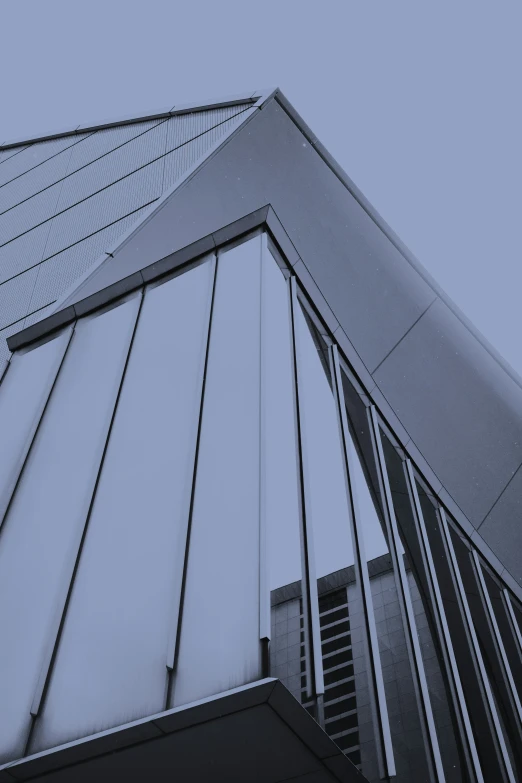 an upward view of the top of a building