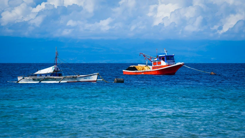 two boats out on the open water