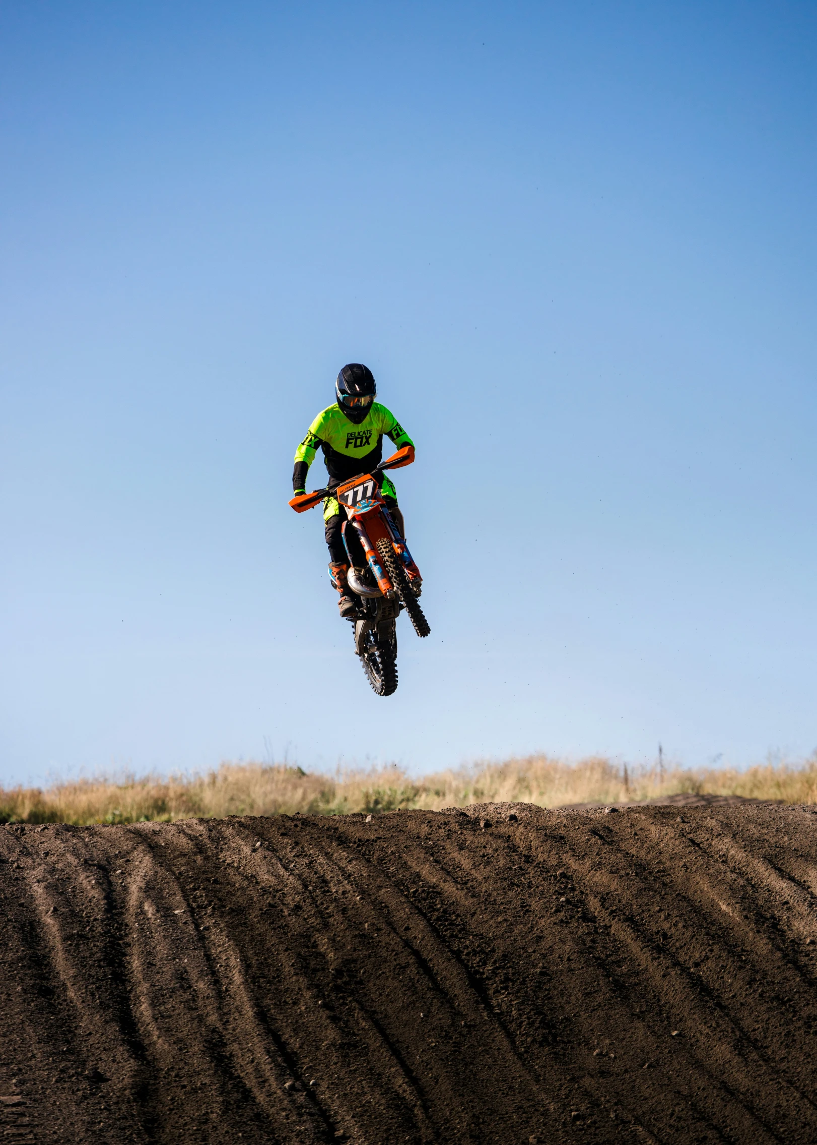 a person on a dirt bike doing a trick