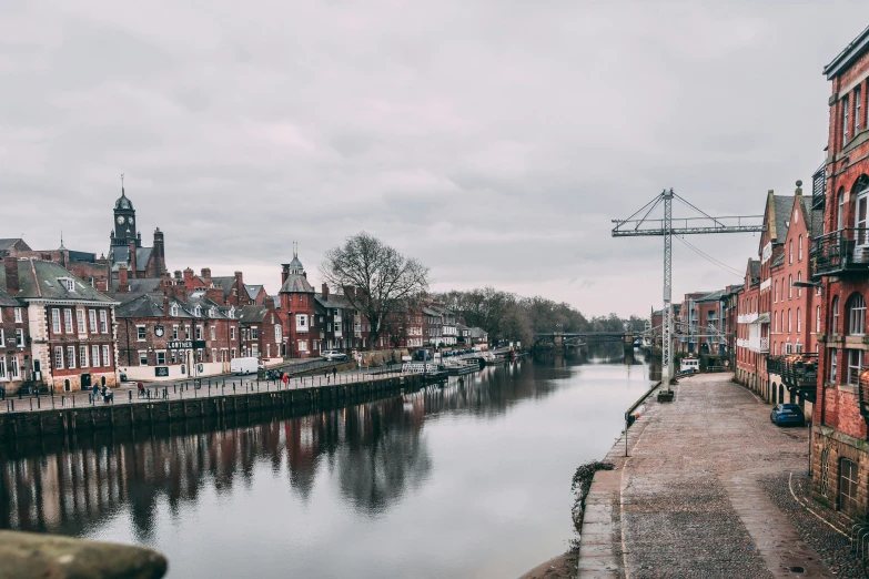 a body of water with brick buildings surrounding it