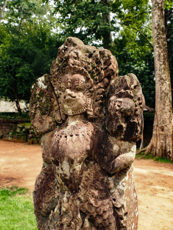 a statue of several people in an enclosure