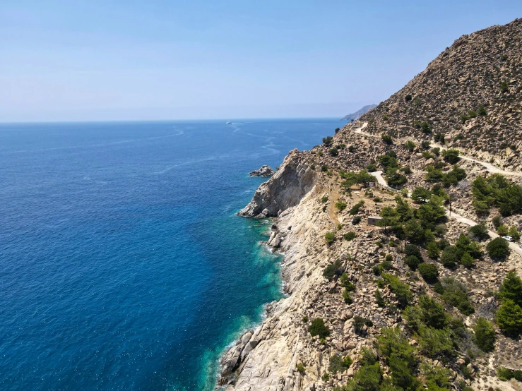 the blue water on a cliff overlooks the coastline