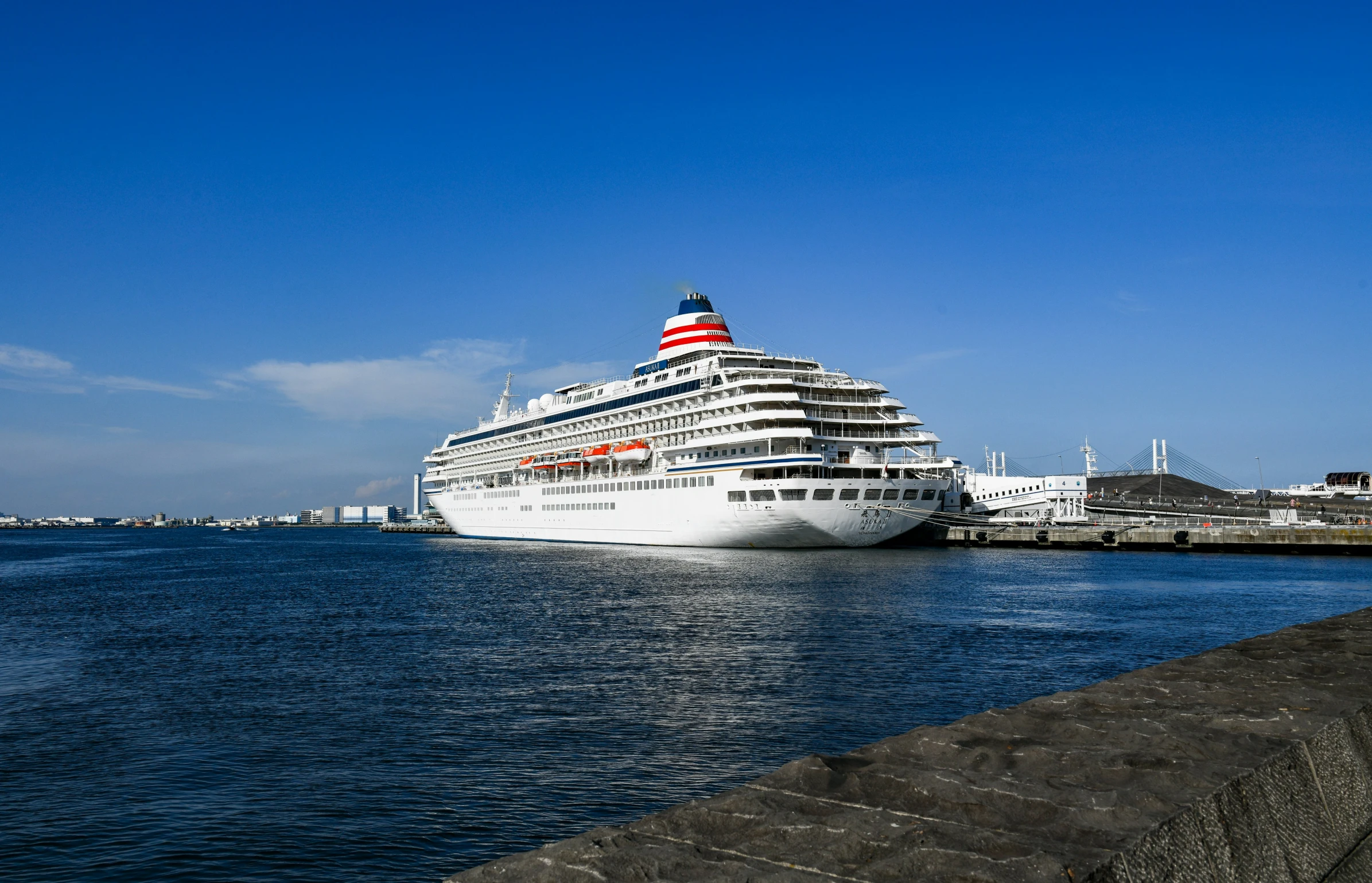 a large cruise ship docked in the water