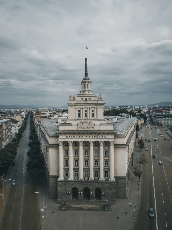 a large white building has two towers on each side of it