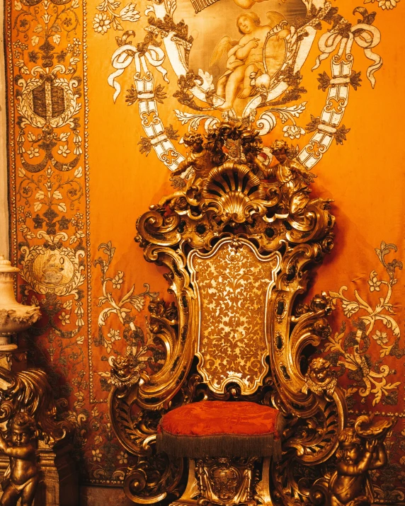 a chair in a room surrounded by decorative wallpaper