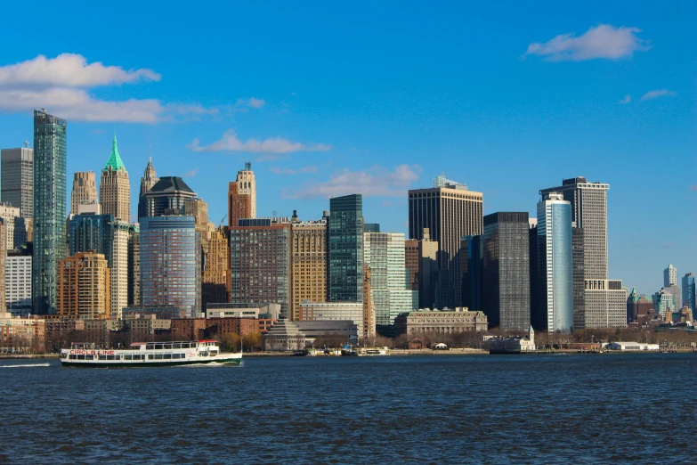 a large body of water with a city in the background