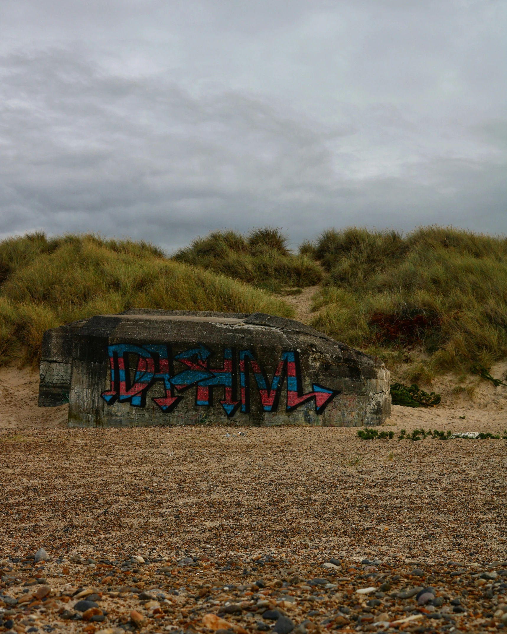 a wall with graffiti spray painted on it