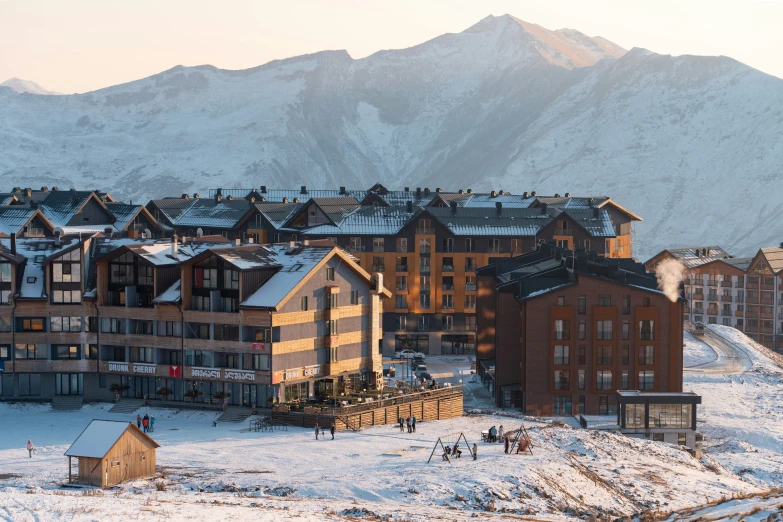 a building is shown in the mountains with snow on it