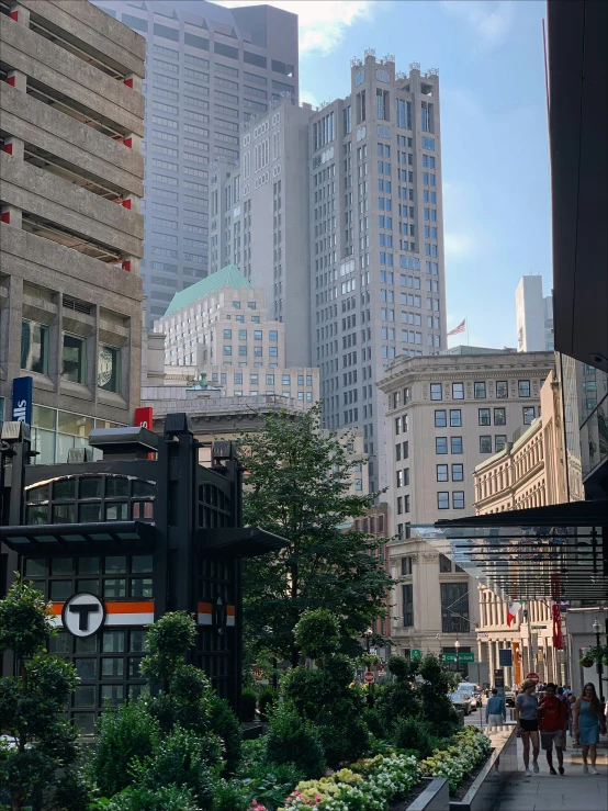 a street filled with tall buildings and people walking