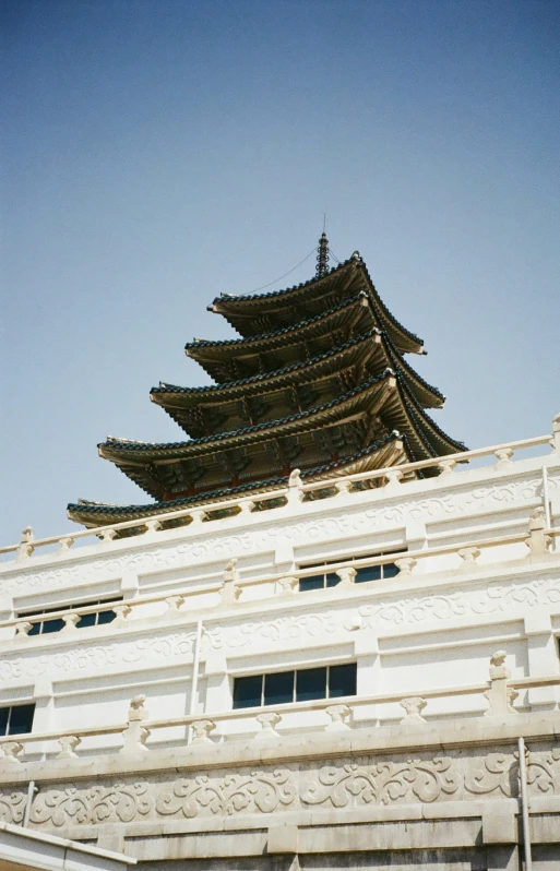 a large building with an intricate roof over it