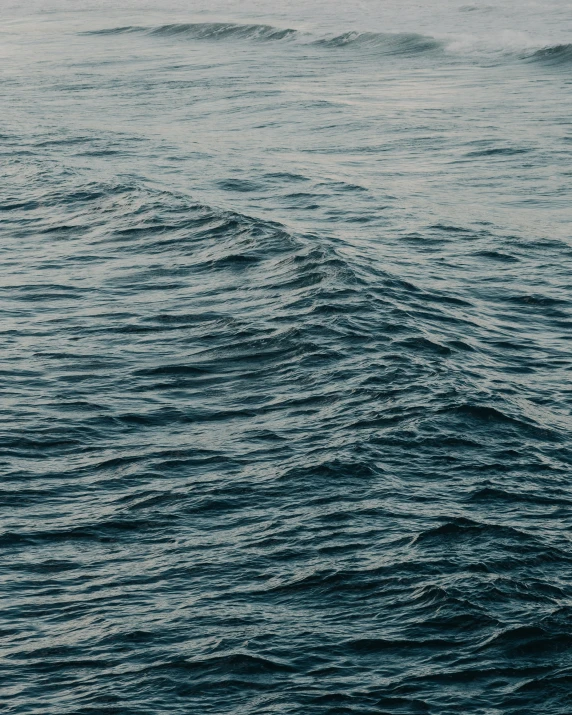 large waves in the ocean on a cloudy day