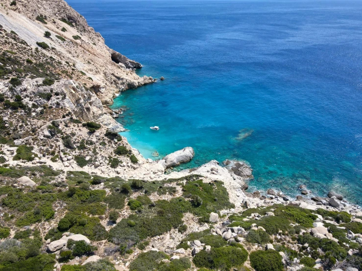 a beach and cliffs on a beautiful ocean