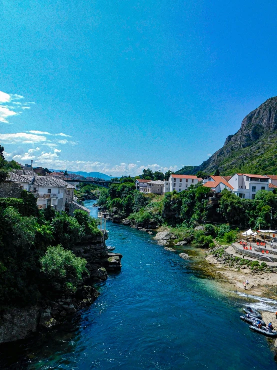 a river with some houses next to it