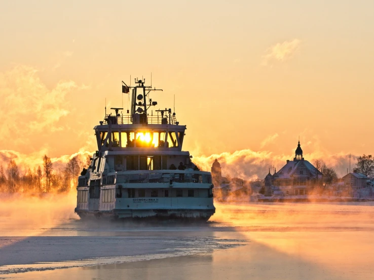 the boat is traveling on a river near the water