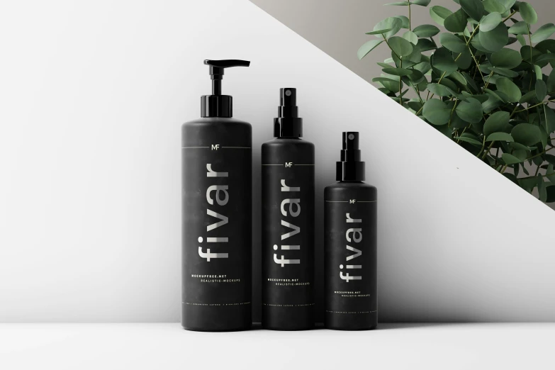 three shampoos are in front of a vase with a plant