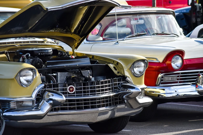 classic car with bonnet opened parked on the side of the street