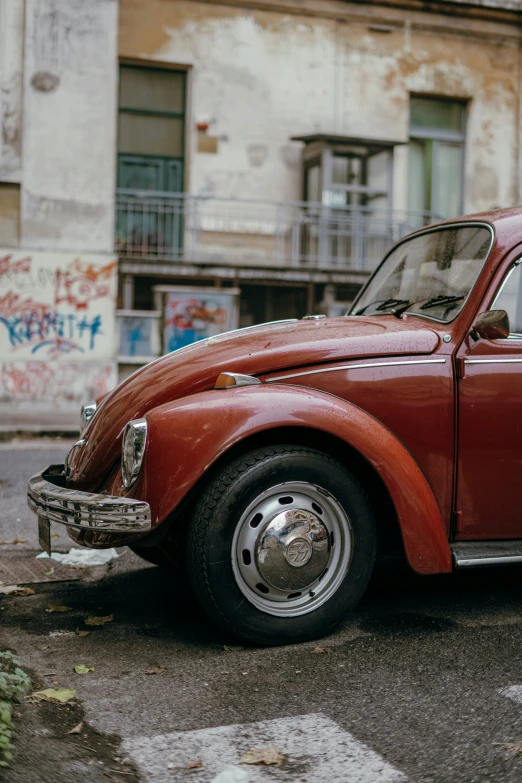 a red car parked in front of a building