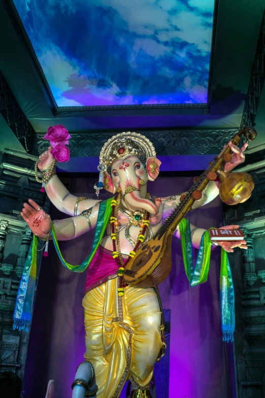 the lord ganesh is playing his guitar