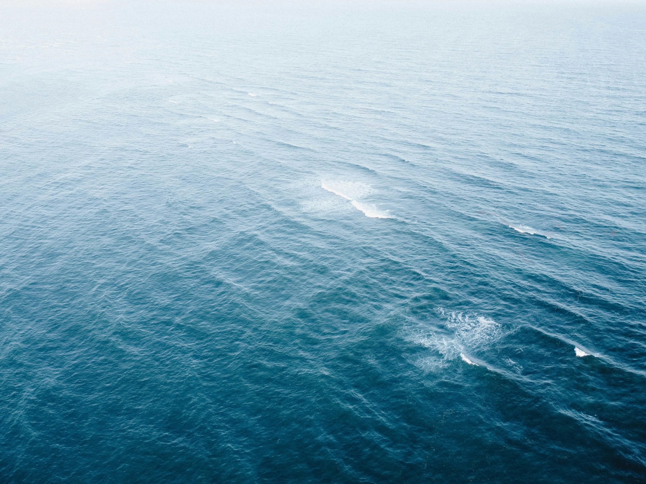 a boat is in the water near a small island