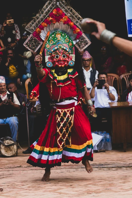 a person in a red and yellow outfit