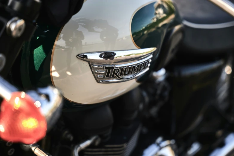 the handle bar and badge on a motorcycle