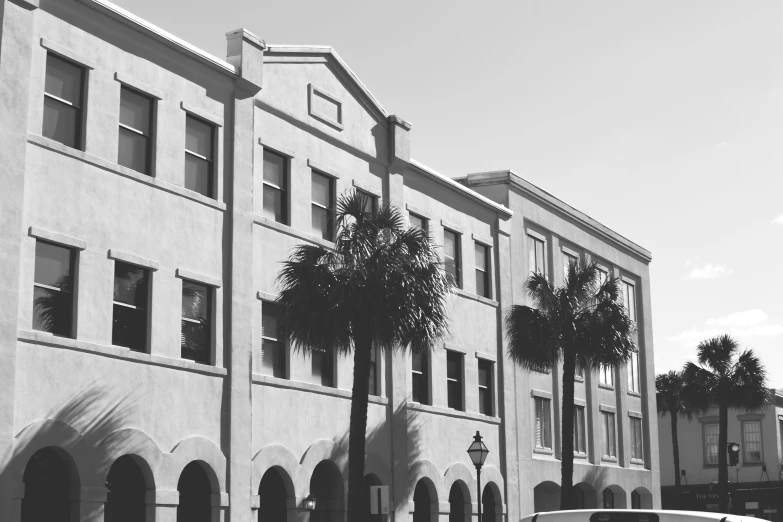 several buildings along side each other with one van parked