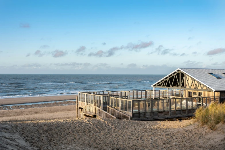 a structure on the beach that is shaped like an umbrella