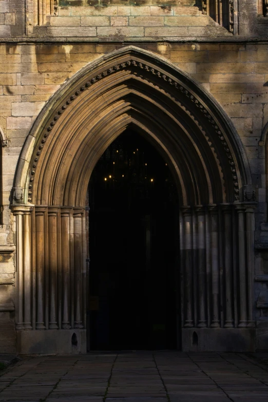 an old building with an entrance and a clock