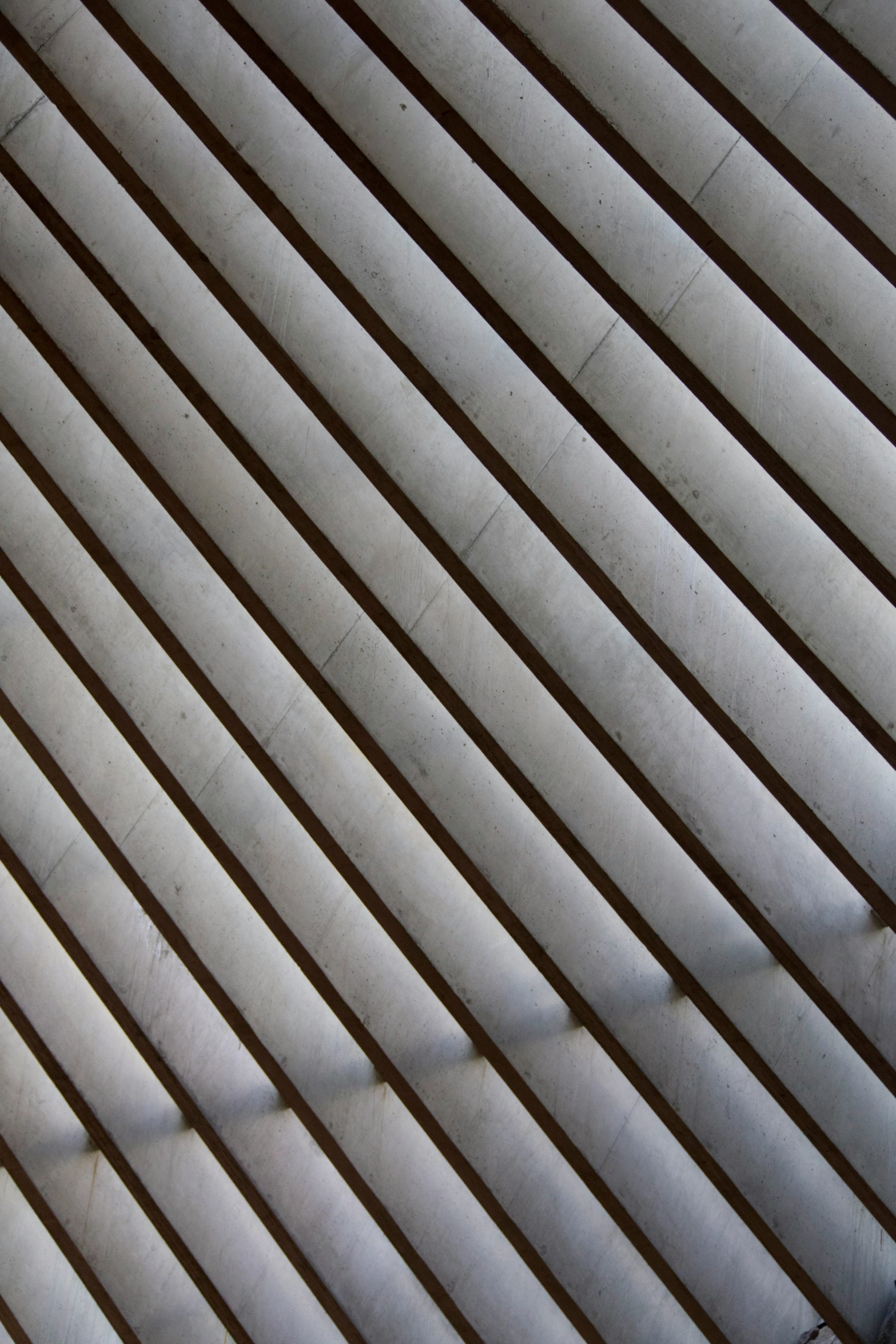 a bench is sitting near a metal fence